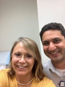 Picture of Cathy with her urologic oncologist and clinical trial director, Dr. Shreyas Joshi .