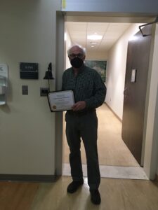 This is a picture of David ringing the bell after his treatments.